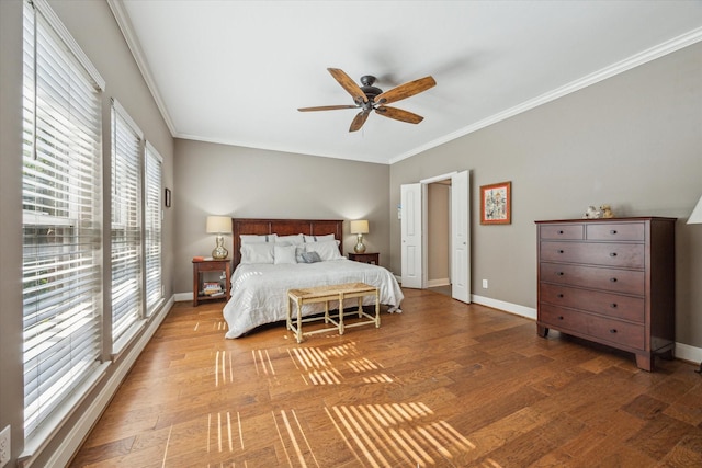 bedroom featuring ceiling fan, hardwood / wood-style floors, and crown molding