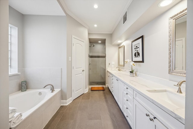 bathroom with tile patterned floors, vanity, separate shower and tub, and a healthy amount of sunlight