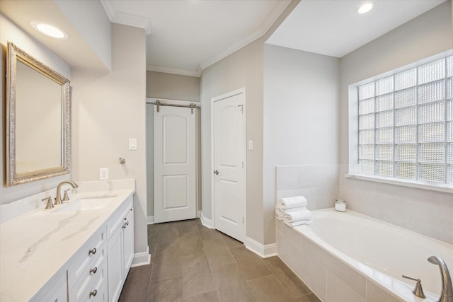 bathroom with vanity, a relaxing tiled tub, tile patterned floors, and ornamental molding