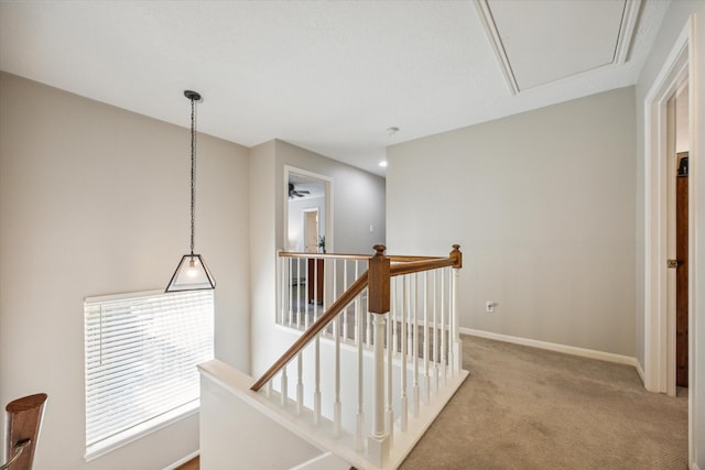 hallway featuring light carpet