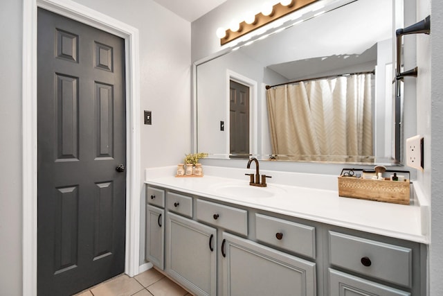 bathroom featuring tile patterned flooring and vanity