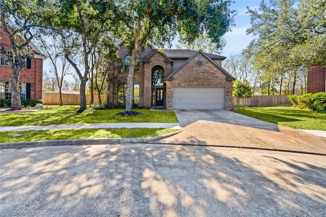 view of front of house with a front lawn and a garage