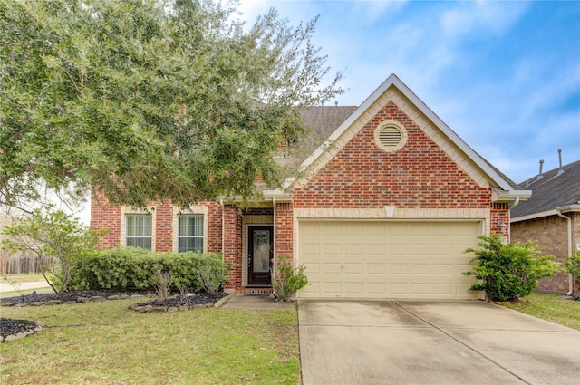 view of front of property featuring a garage and a front yard