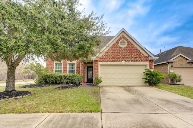 view of front of property featuring a front yard and a garage