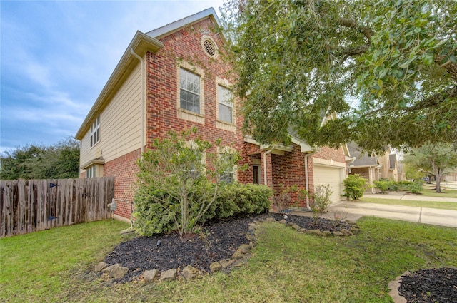 view of front of house with a garage and a front lawn