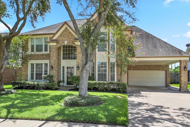 view of front of property with a garage and a front lawn