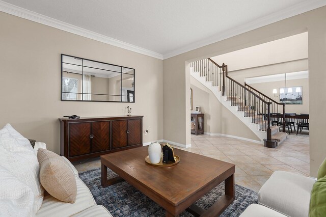 tiled living room with ornamental molding and an inviting chandelier