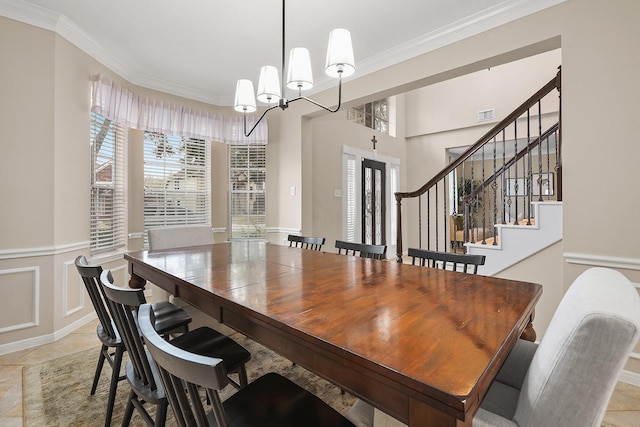 tiled dining area with crown molding, a wealth of natural light, and an inviting chandelier