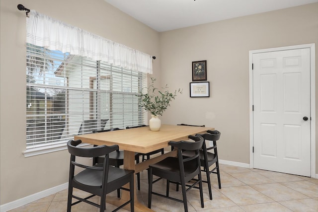 dining space featuring light tile patterned floors