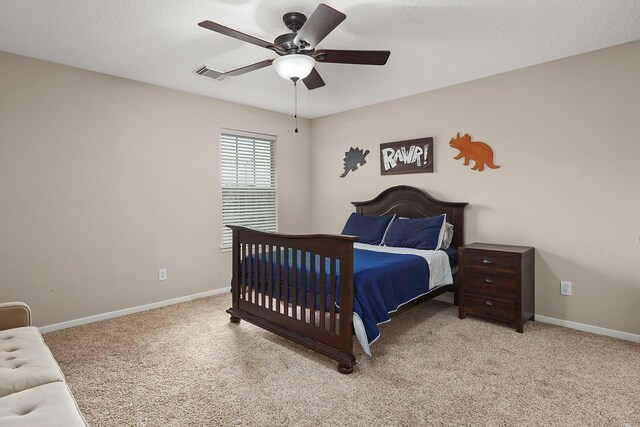 carpeted bedroom with ceiling fan