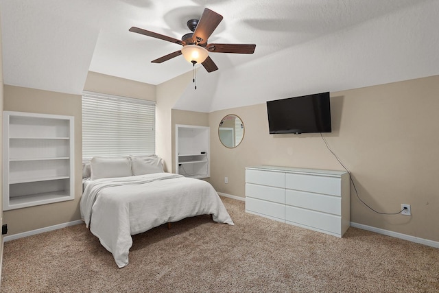 carpeted bedroom featuring ceiling fan, a textured ceiling, and vaulted ceiling