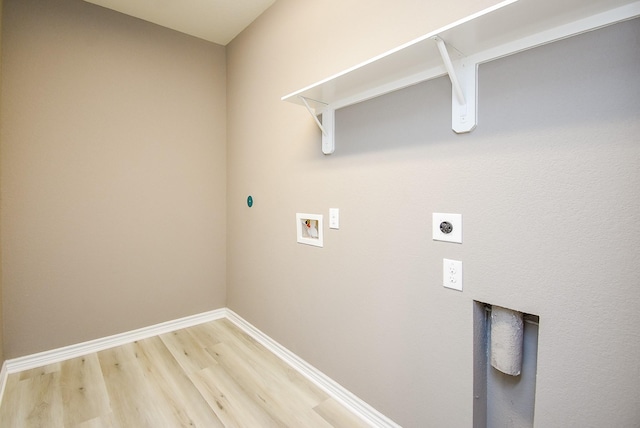 laundry area with hookup for an electric dryer, hookup for a washing machine, and wood-type flooring