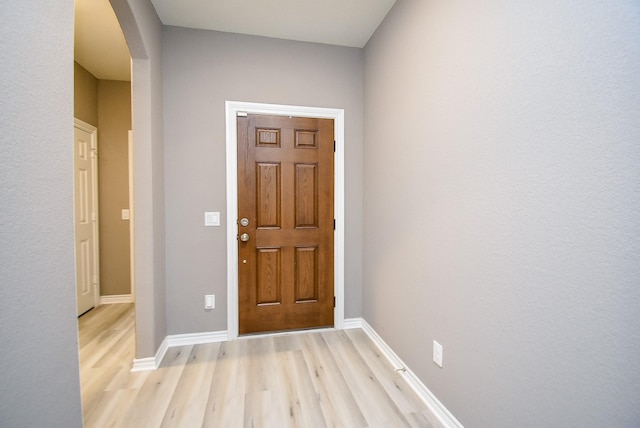 entryway with light hardwood / wood-style floors