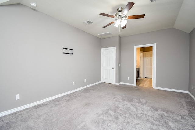 unfurnished bedroom with ceiling fan, light carpet, and vaulted ceiling