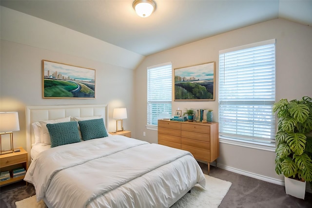 carpeted bedroom featuring lofted ceiling