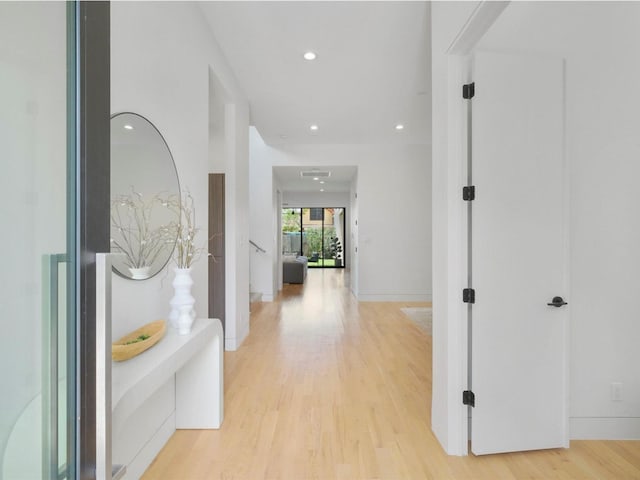 corridor with light wood-type flooring