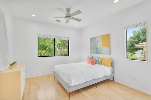 bedroom featuring ceiling fan and wood-type flooring