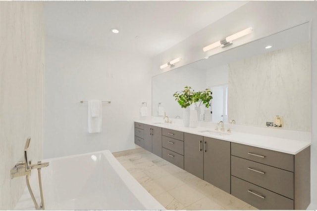 bathroom featuring a bath and vanity