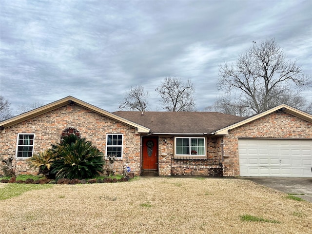 single story home featuring a garage and a front yard