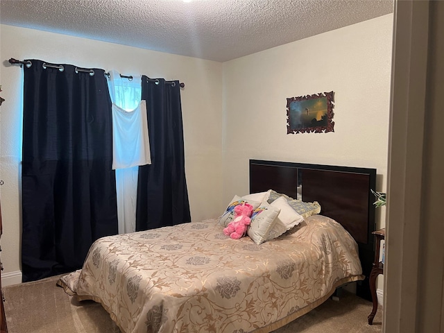 carpeted bedroom with a textured ceiling