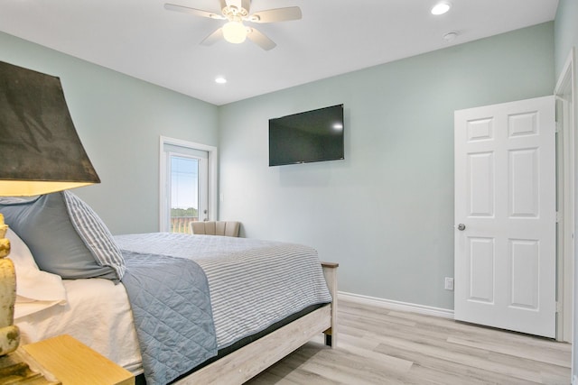 bedroom featuring light hardwood / wood-style floors and ceiling fan