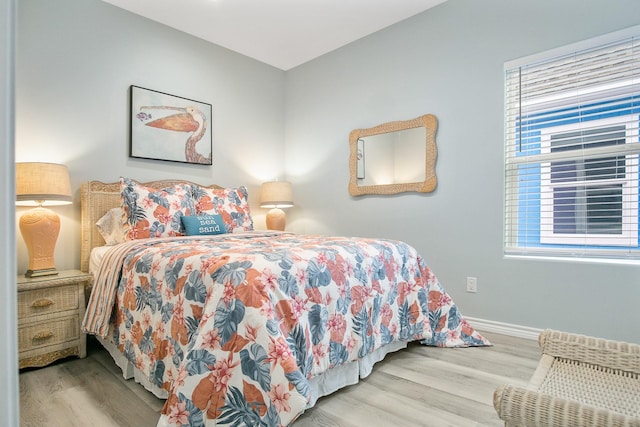 bedroom with light hardwood / wood-style flooring