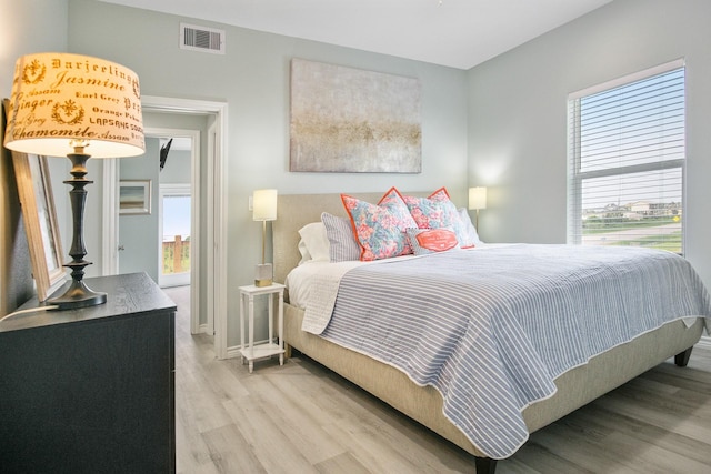 bedroom with light wood-type flooring