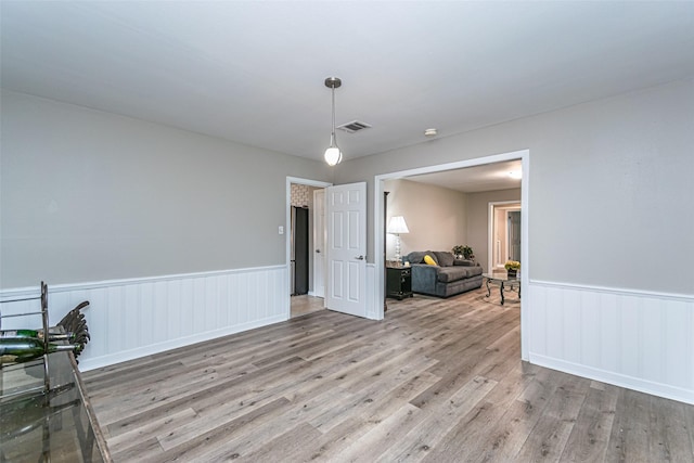 unfurnished room featuring light hardwood / wood-style flooring