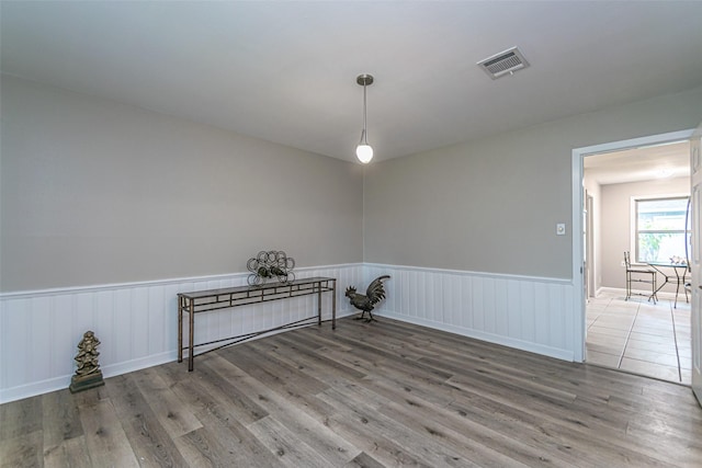 empty room with hardwood / wood-style flooring