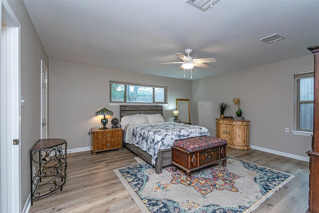 bedroom featuring light hardwood / wood-style floors and ceiling fan