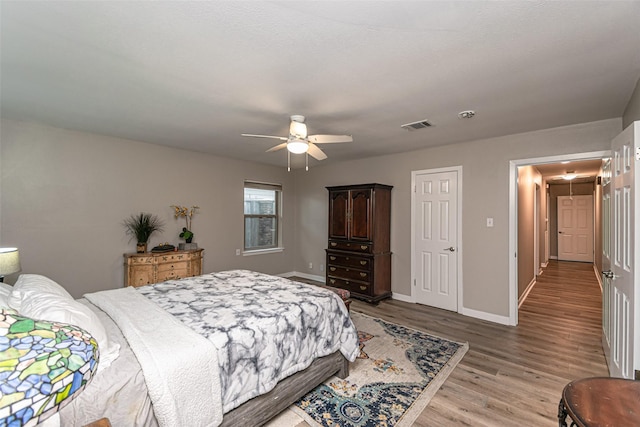 bedroom featuring ceiling fan and light wood-type flooring