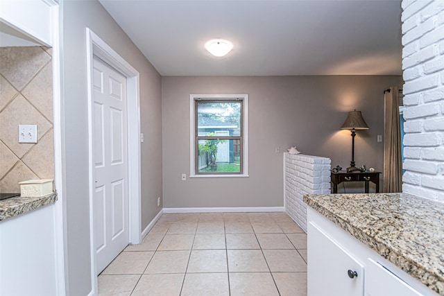 interior space with light tile patterned flooring