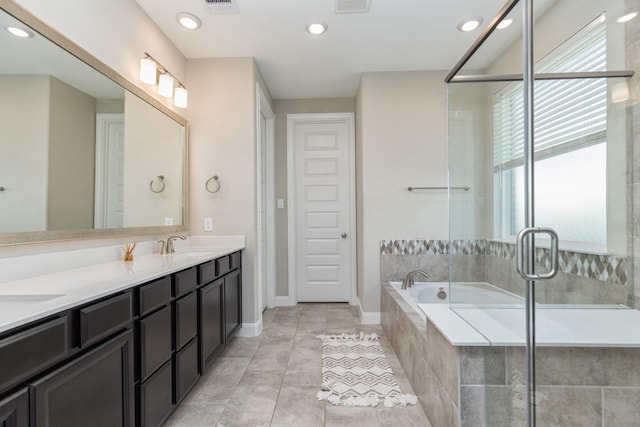 bathroom featuring vanity, separate shower and tub, and tile patterned flooring