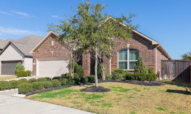 front of property with a garage and a front lawn