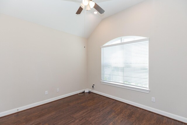 spare room with ceiling fan, dark hardwood / wood-style floors, and lofted ceiling