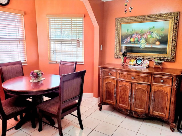 dining space with light tile patterned floors