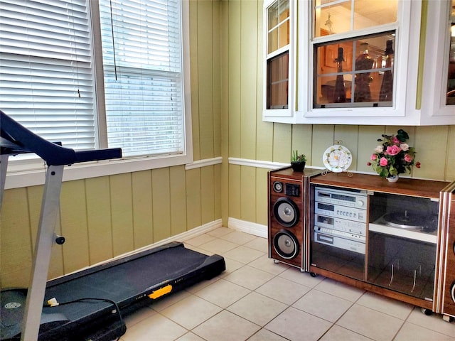 exercise room with light tile patterned floors