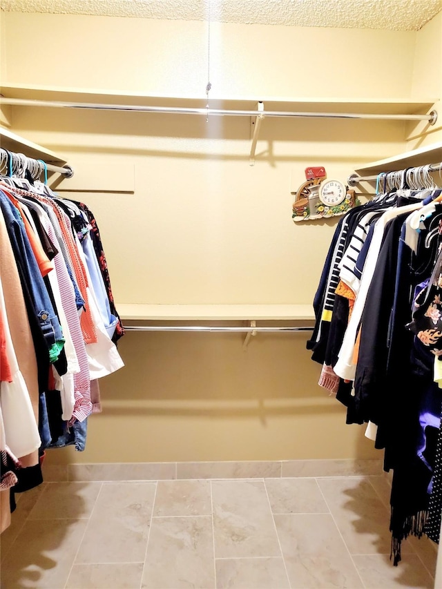 spacious closet with tile patterned flooring