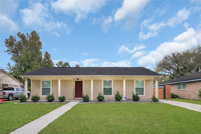 ranch-style house featuring a front yard and covered porch