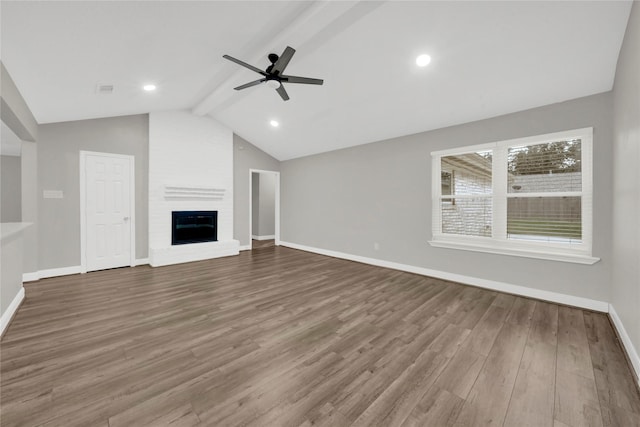 unfurnished living room featuring vaulted ceiling with beams, ceiling fan, wood-type flooring, and a fireplace