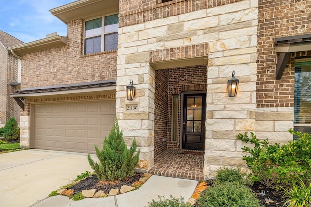 view of exterior entry featuring a garage