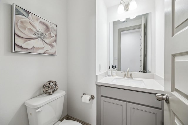 bathroom with vanity and toilet