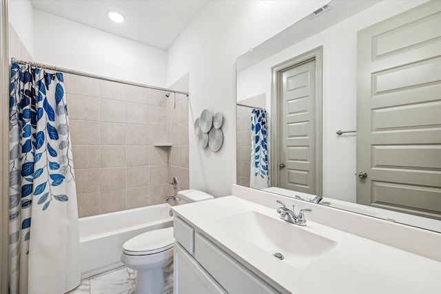 full bathroom featuring shower / bath combo, vanity, and toilet