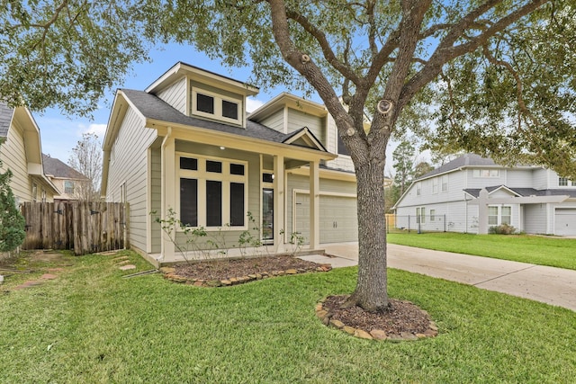 view of front of home featuring a garage and a front yard