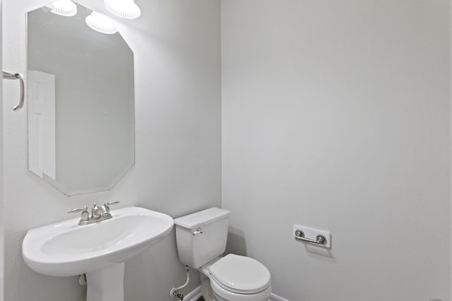 bathroom with toilet and sink