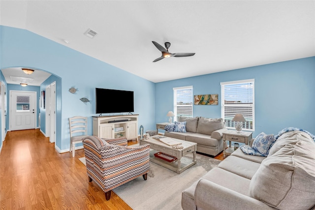 living room featuring vaulted ceiling, light wood-type flooring, and ceiling fan