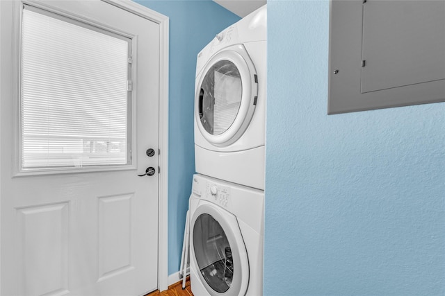 laundry room featuring stacked washer / dryer