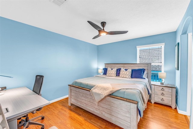 bedroom featuring ceiling fan and light hardwood / wood-style flooring