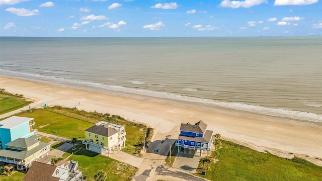 bird's eye view featuring a beach view and a water view