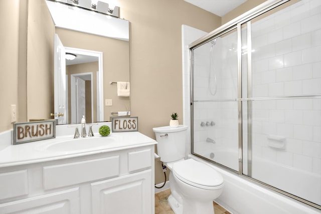 full bathroom with vanity, enclosed tub / shower combo, and toilet